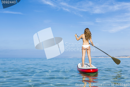 Image of Woman practicing paddle