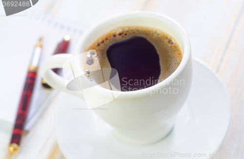 Image of coffee and note