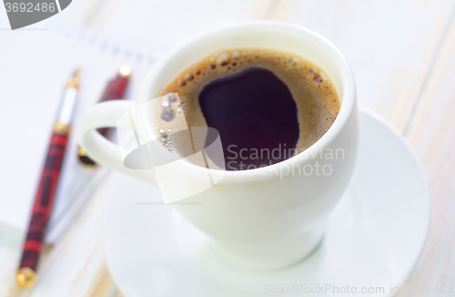 Image of coffee and note