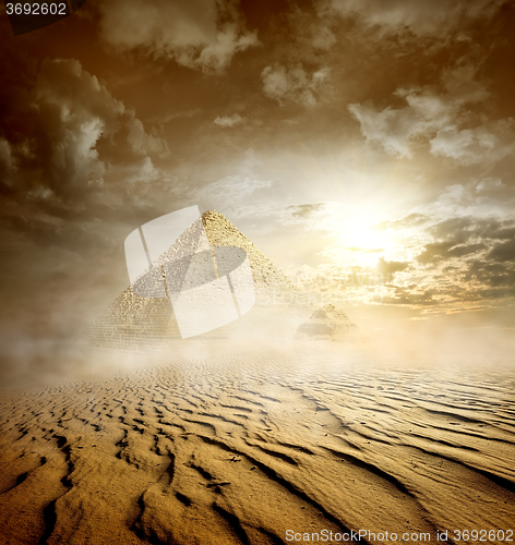 Image of Storm clouds and pyramids