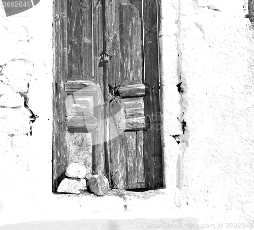 Image of blue door in antique village santorini greece europe and    whit