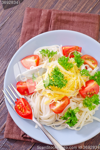 Image of pasta with cheese and tomato