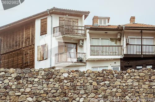 Image of Houses Behind a Wall