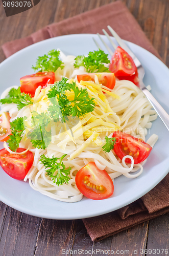 Image of pasta with cheese and tomato