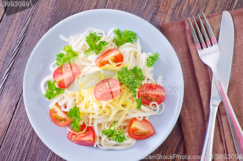 Image of pasta with cheese and tomato