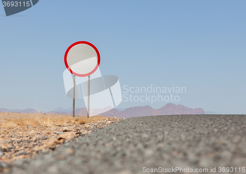 Image of Speed limit sign at a desert road