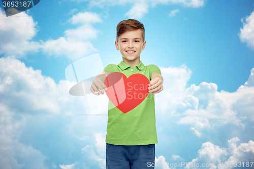 Image of happy boy holding red heart shape