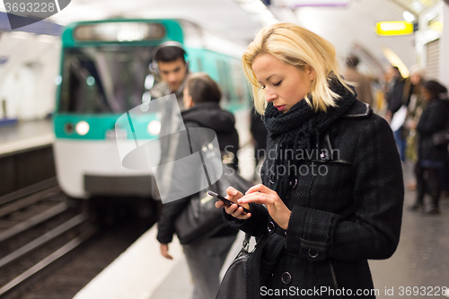 Image of Woman on a subway station.