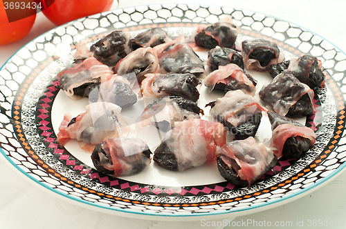 Image of 
Prunes wrapped in bacon and baked