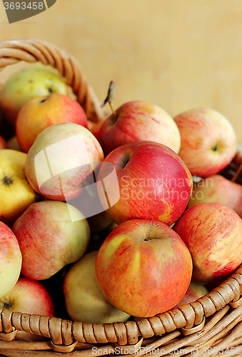 Image of Ripe red apples in a basket 