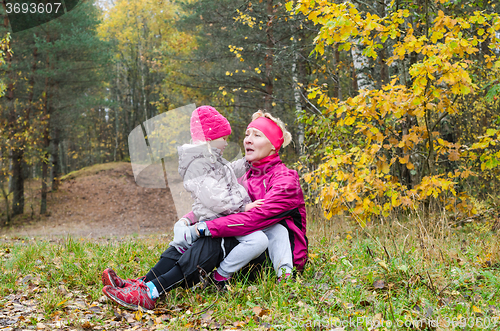 Image of Grandmother with her granddaughter in the park