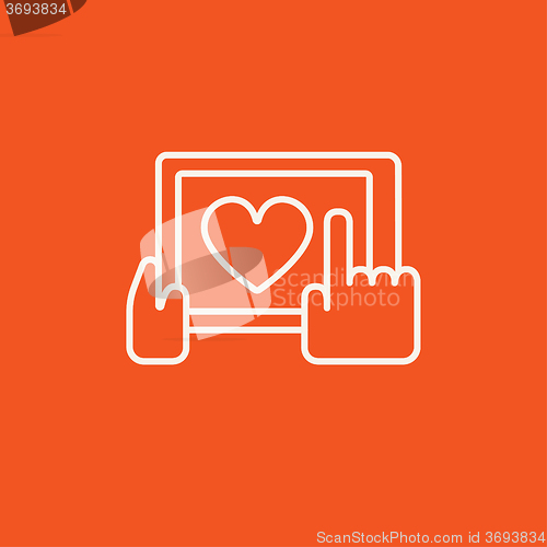 Image of Hands holding tablet with heart sign line icon.