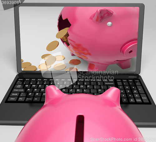 Image of Coins Piggy Laptop Shows Banking Financial Success