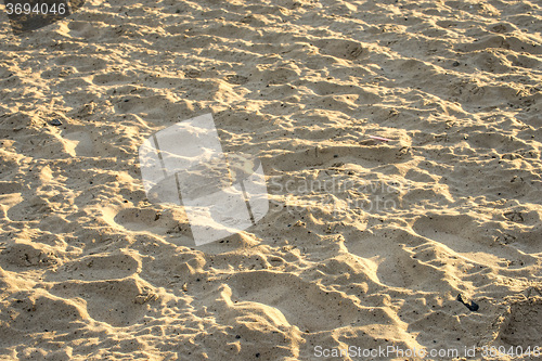 Image of Sand of a beach with waves