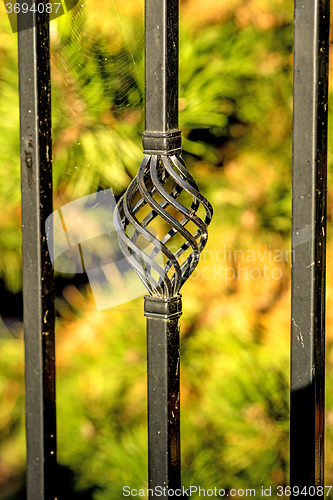 Image of fence with green background