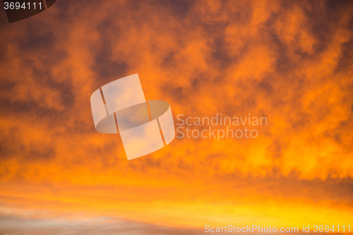 Image of sky with red clouds during sunrise