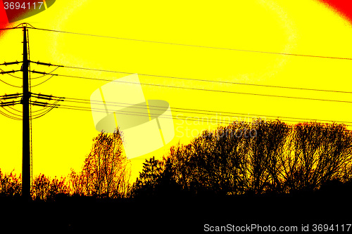 Image of sunset with afterglow and power mast