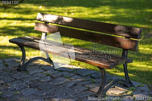 Image of park bench in soft autumnal sun