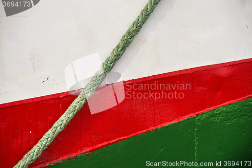 Image of ship hull with pretty colors and mooring line