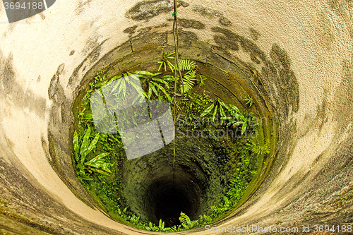 Image of old, deep, medieval well of a castle