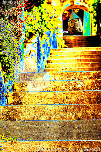 Image of mystic stairs with view to an odd old tower