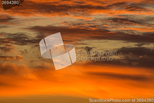 Image of sky with red clouds during sunrise