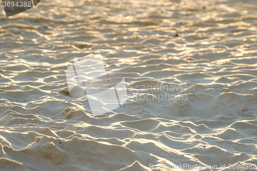 Image of Sand of a beach with waves