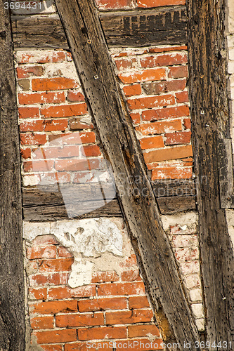Image of brick wall of an old frame house