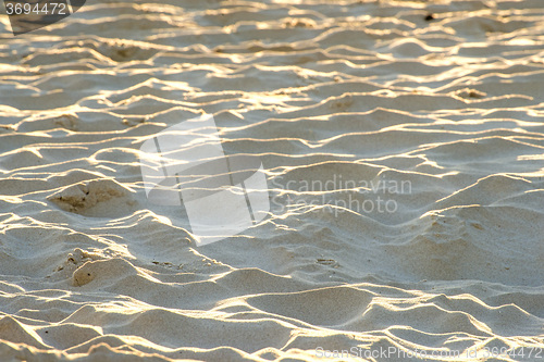 Image of Sand of a beach with waves