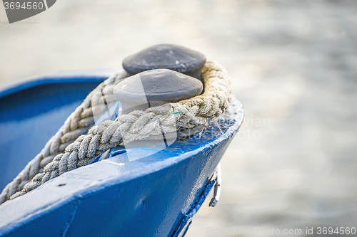 Image of Ship bow with mooring lines in an harbor