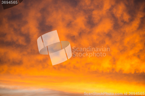 Image of sky with red clouds during sunrise