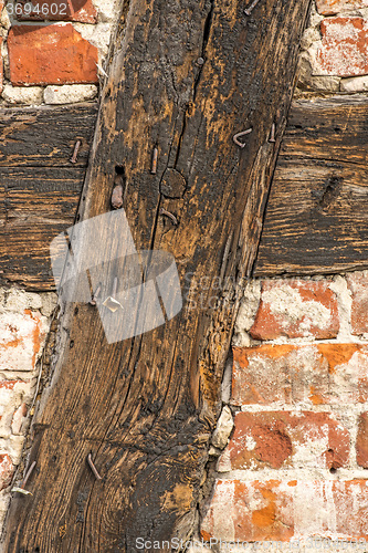 Image of brick wall of an old frame house