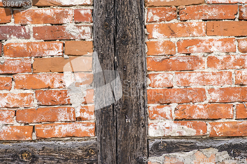 Image of brick wall of an old frame house