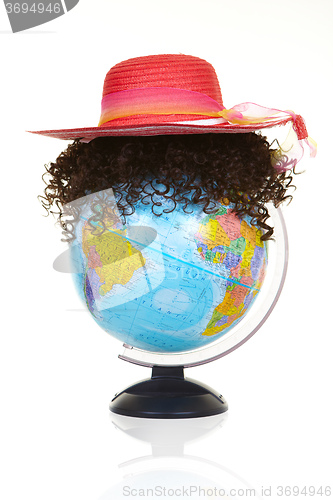 Image of The terrestrial globe and curly wig