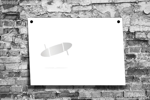 Image of Sheet of a paper on a wall