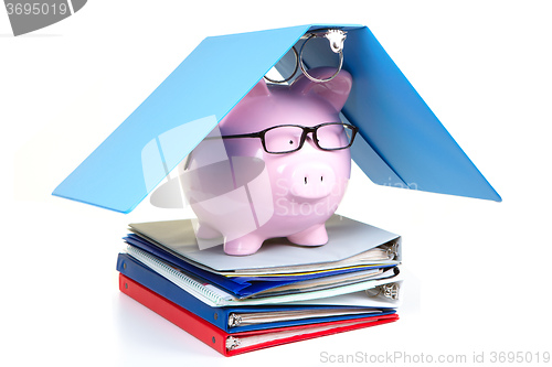 Image of Pink piggy bank and documents