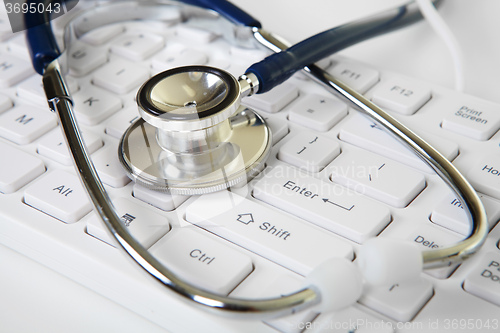Image of Phonendoscope and white keyboard