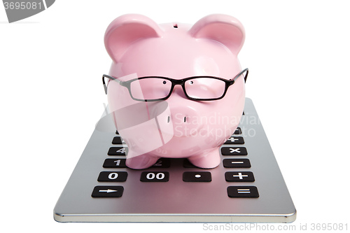 Image of Pig bank and calculator