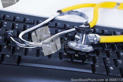 Image of Phonendoscope and black keyboard