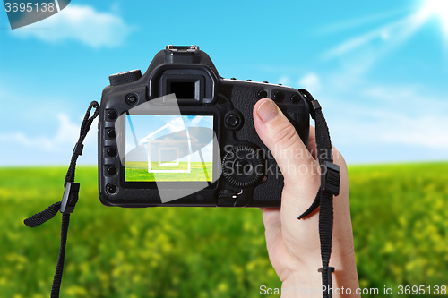 Image of The  house and digital photographic camera