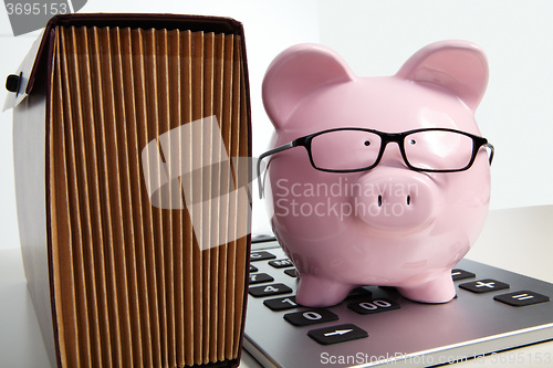 Image of Pig bank and brief case