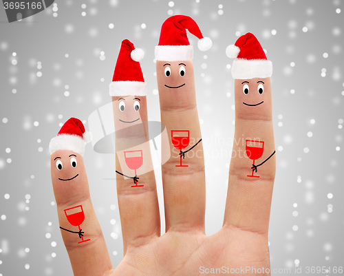 Image of Happy fingers drink champagne