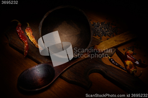 Image of Red pepper and wooden crockery