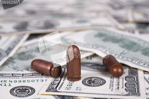 Image of Dollars and cartridge