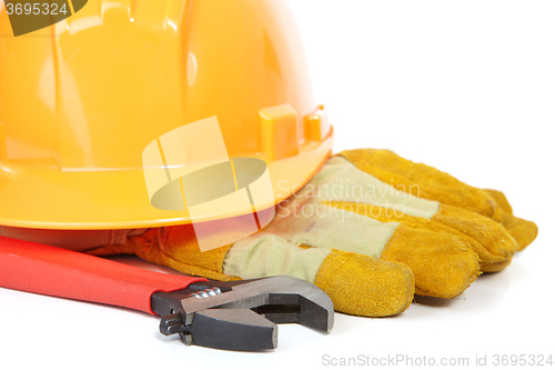 Image of Helmet, spanner and coarse leather gloves