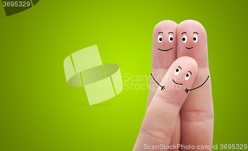 Image of A happy family on green background