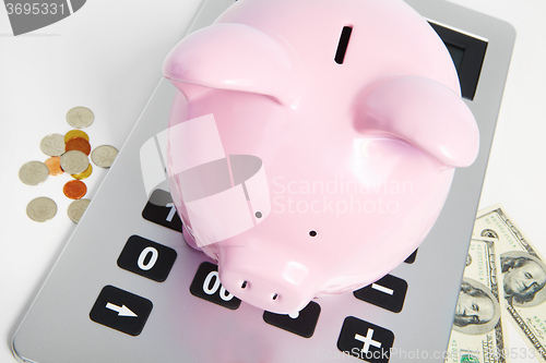 Image of Pig bank and calculator