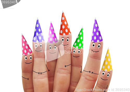 Image of Happy fingers in multicolored caps on a white background