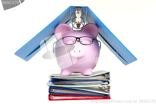 Image of Pink piggy bank and documents