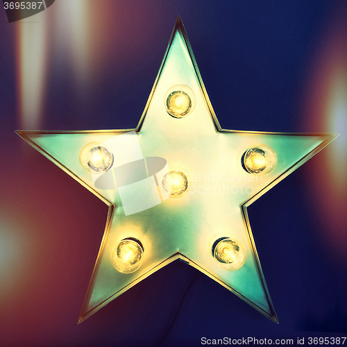 Image of Retro star with light bulbs